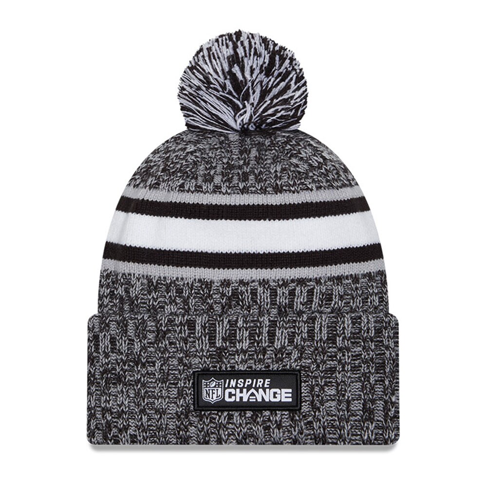 New York Giants mens new era heather black new york giants 2023 inspire change cuffed knit hat with pom | Giants Shop